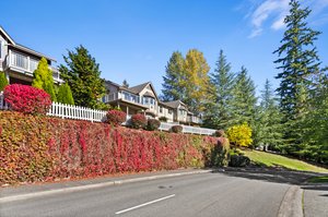 View of the back of the townhome with the beautiful fall colors of the community