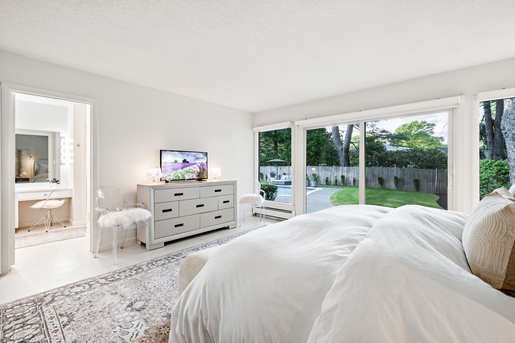 Primary bedroom with sliders to the yard