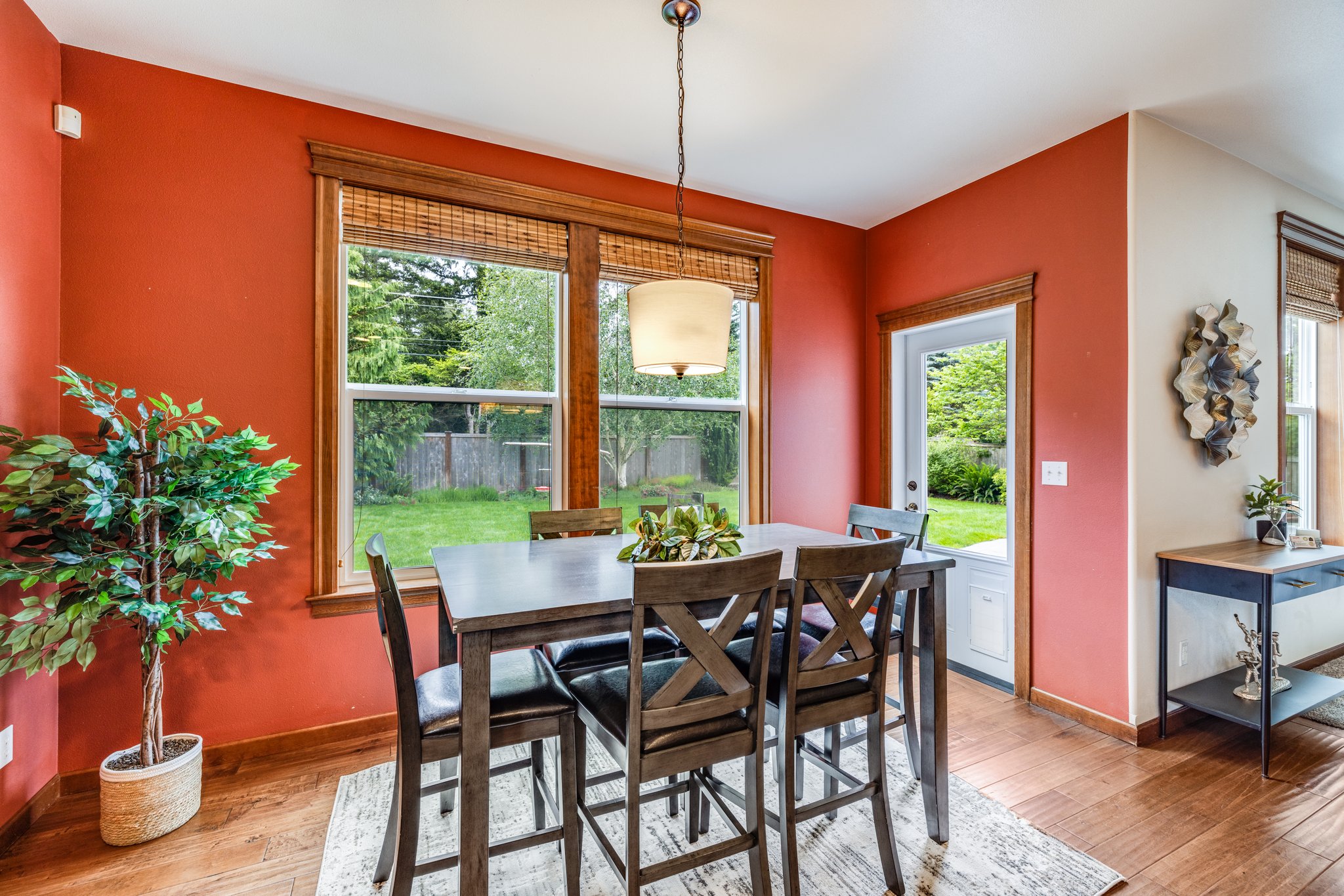 Informal dining area next to kitchen with door leading to back yard/patio area