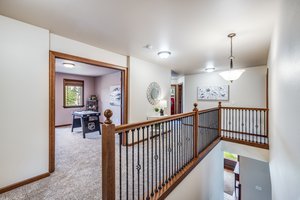 Wide hallway leads to bonus, all bedrooms, full bath and laundry