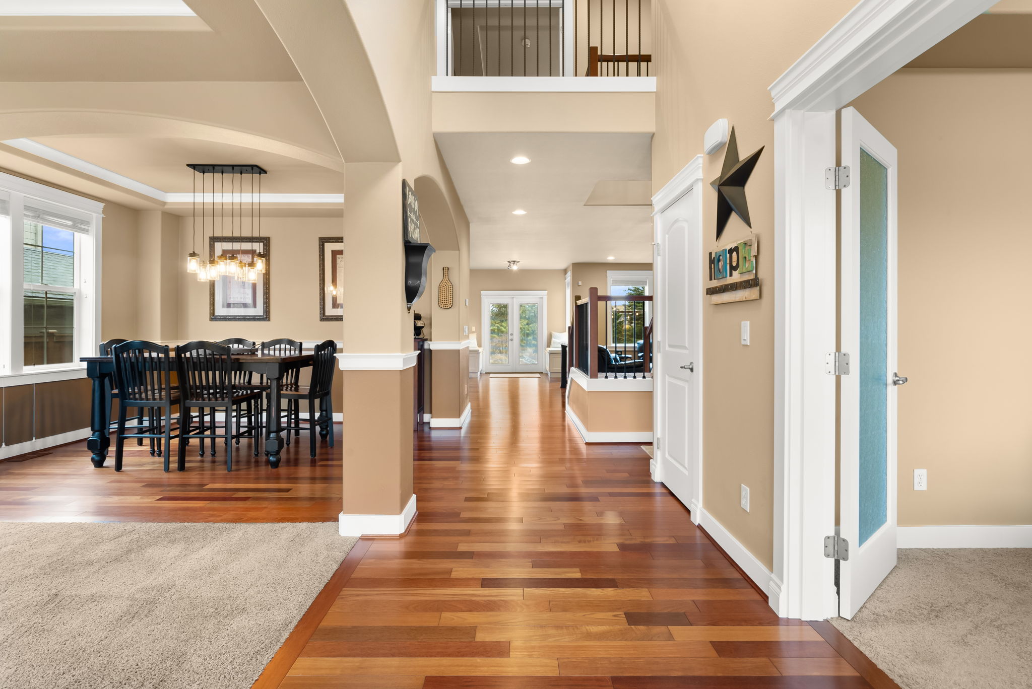Upon entering, the home gracefully unfolds into a welcoming space, featuring both a formal dining area and a sophisticated living room, complemented by the added benefit of a dedicated, private office area.