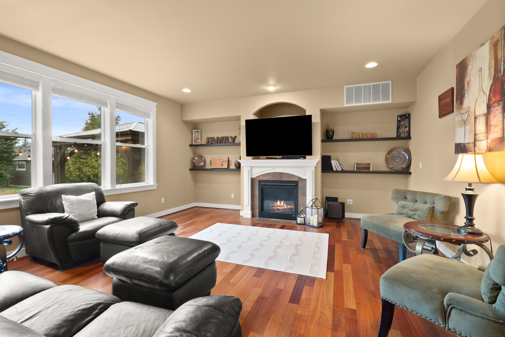Light-filled living room with natural gas fireplace for year-round comfort.