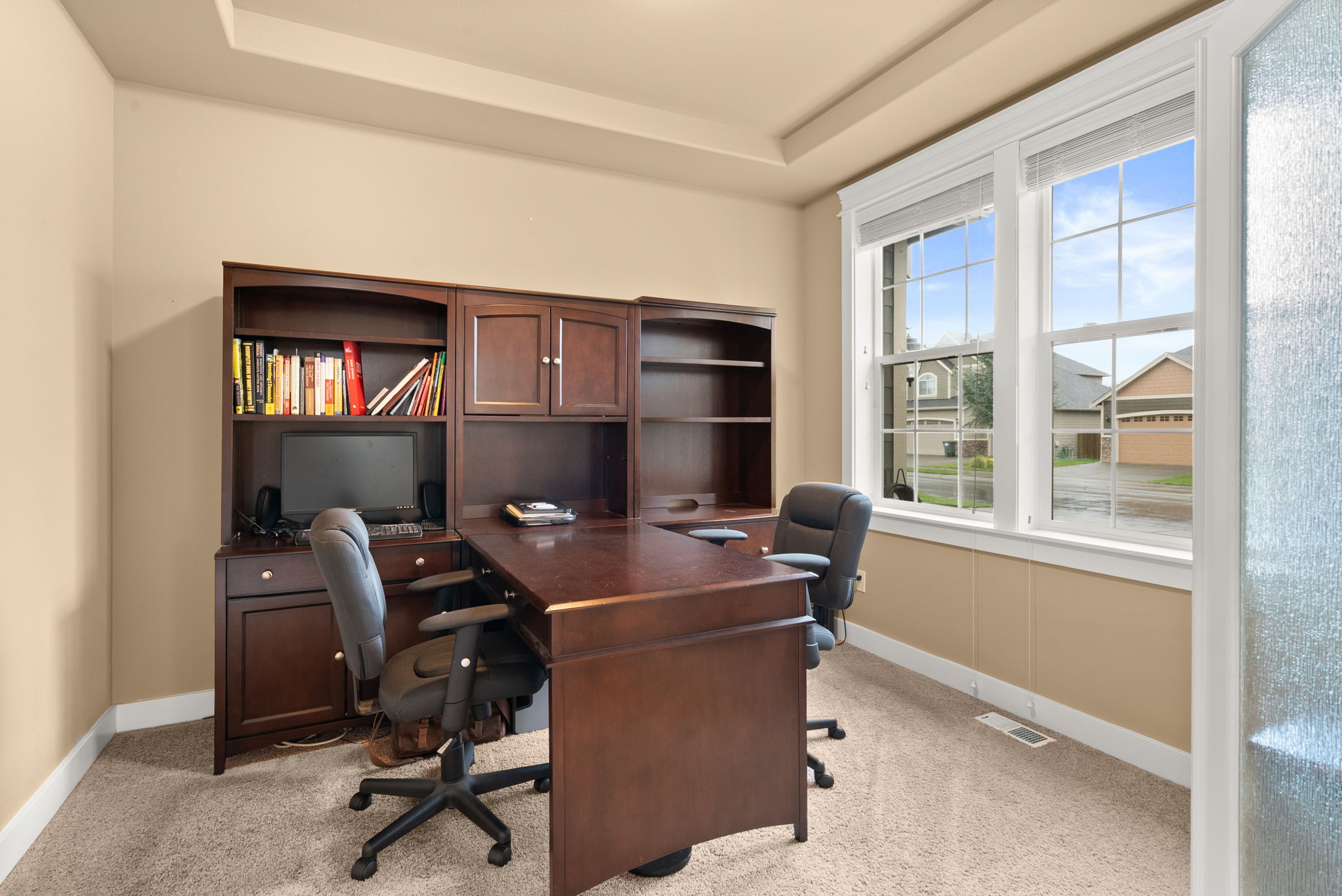 Front-facing main-floor office offering privacy and flexibility.