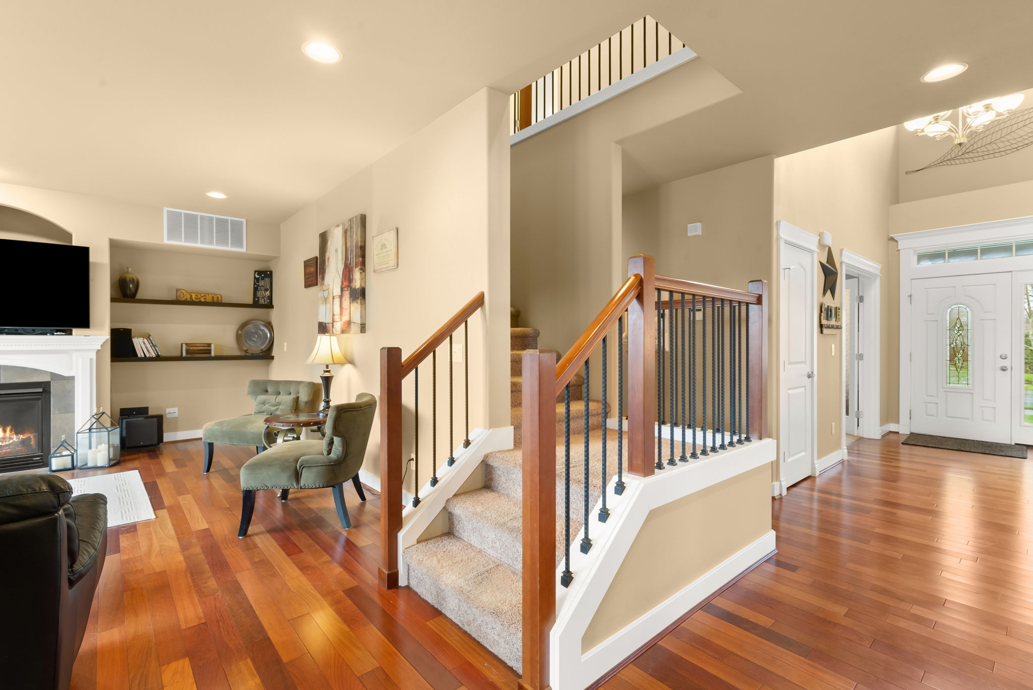 Elegant wrought iron staircase adds architectural distinction.