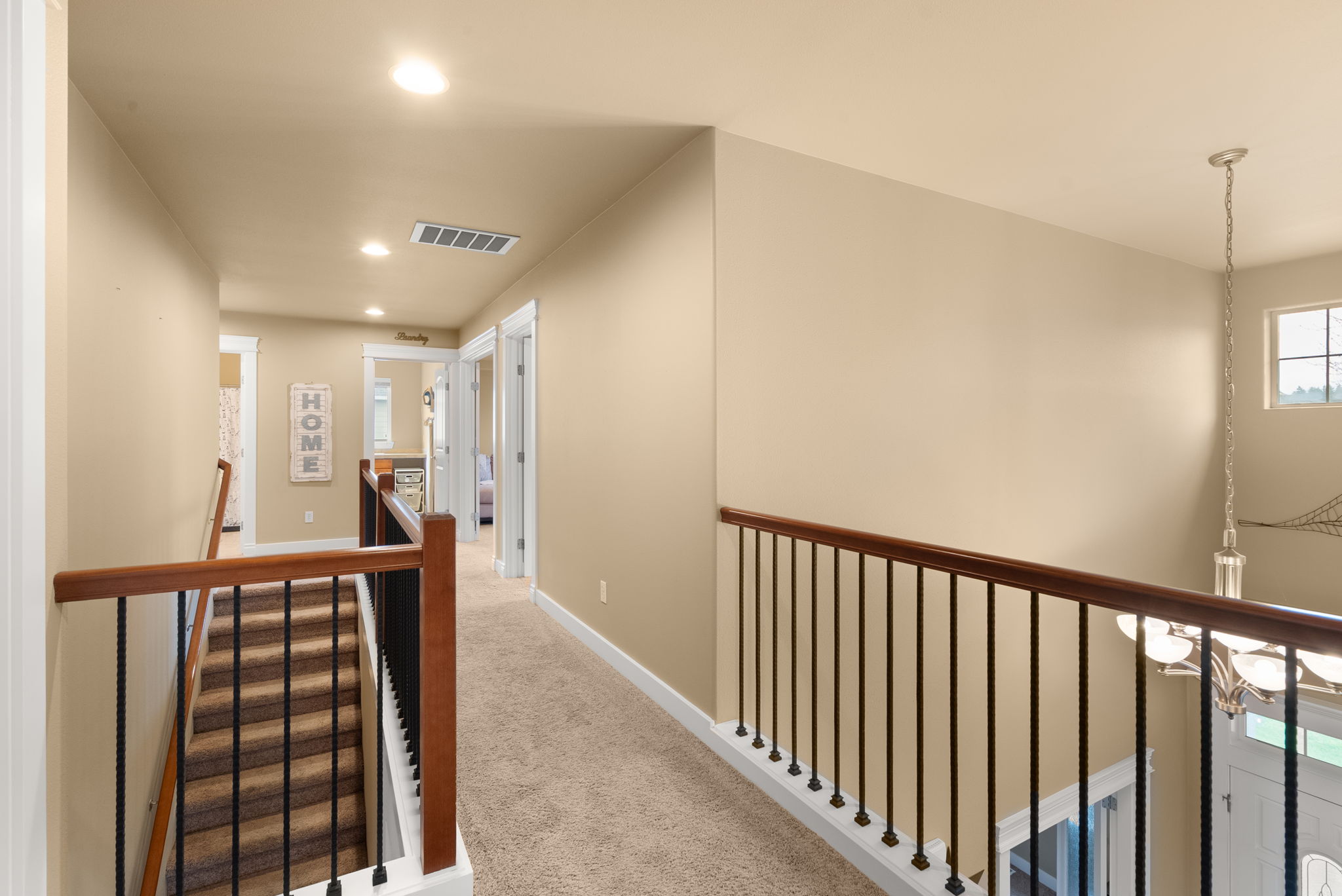 Spacious upstairs landing overlooking the formal entry.