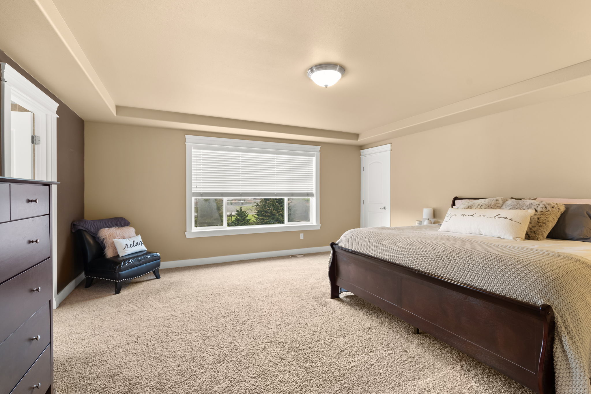 Private primary retreat overlooking the landscaped yard.