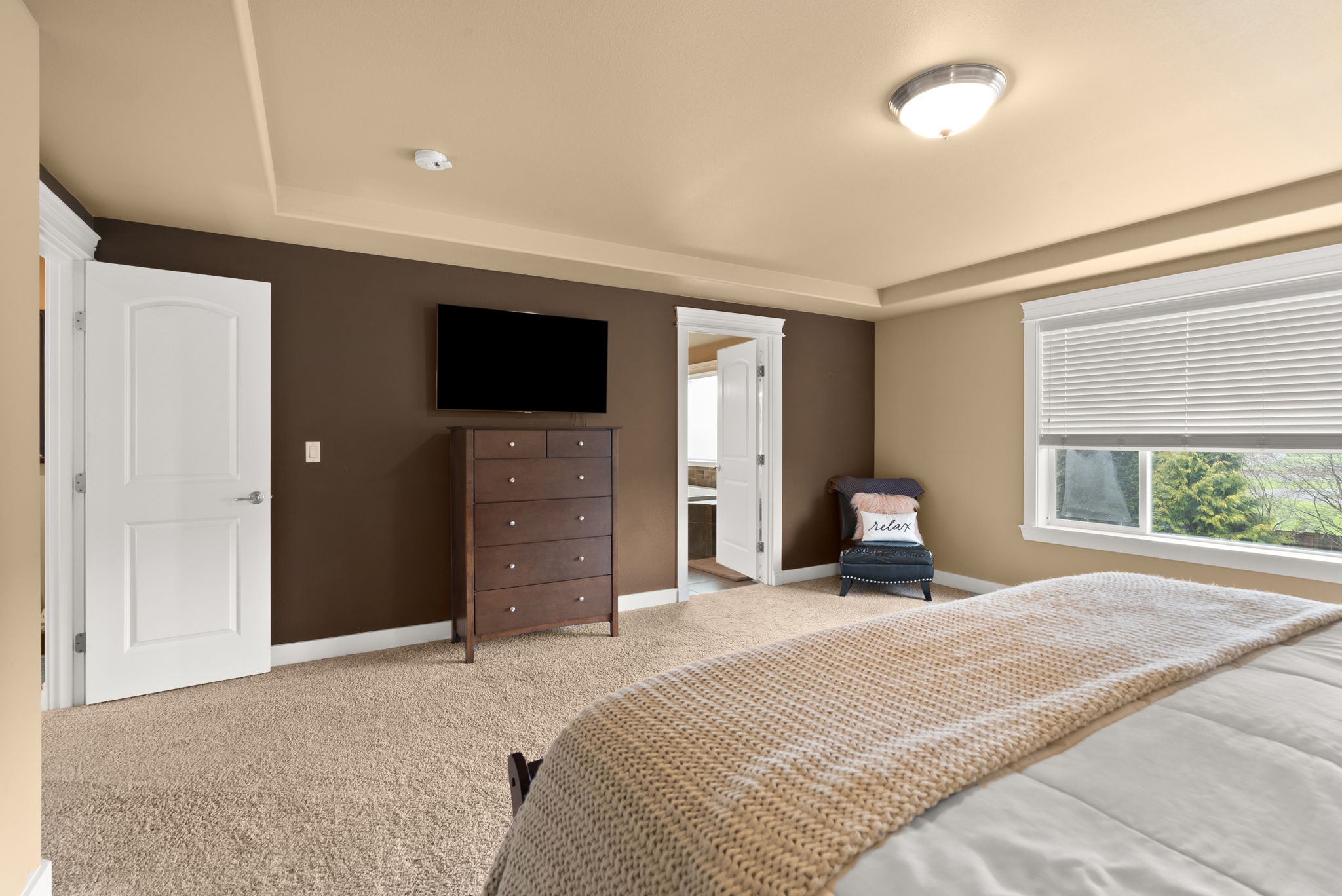 Primary bedroom with plenty of space to have a seating area.