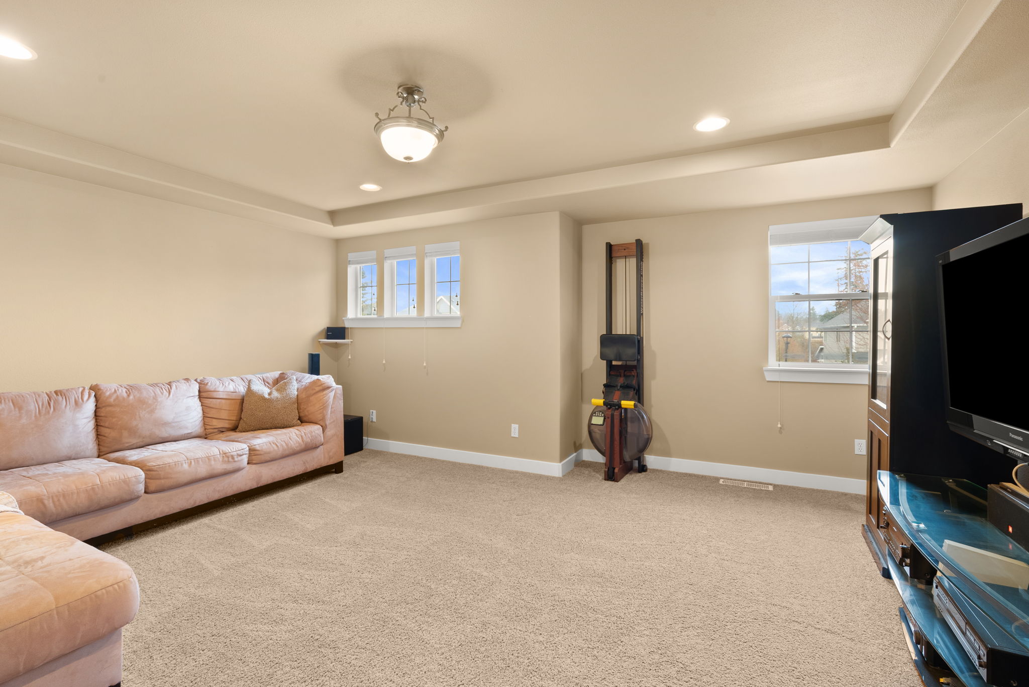 Spacious bonus room ideal for media, play, or relaxation