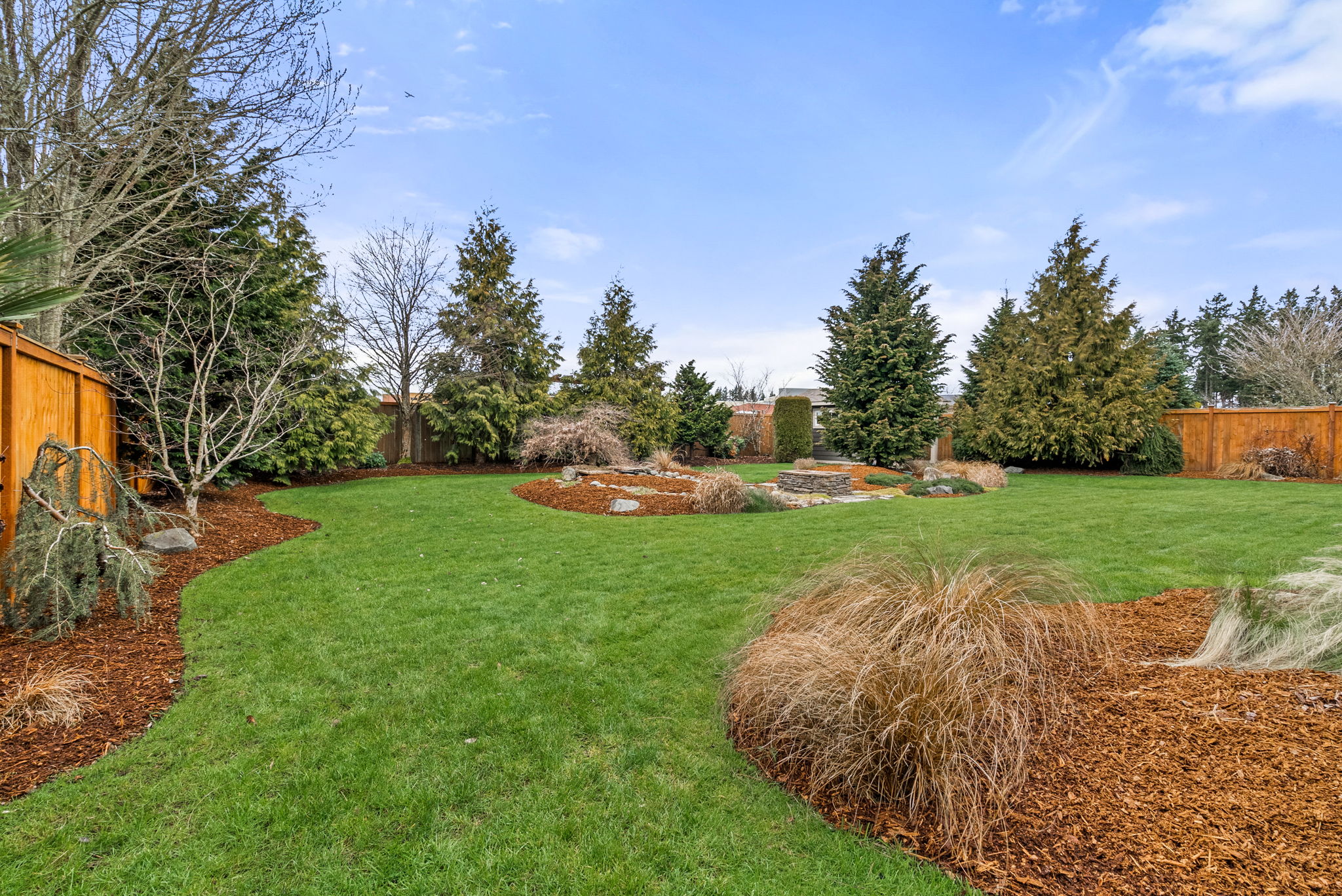 Private backyard oasis complete with irrigation and custom water features.