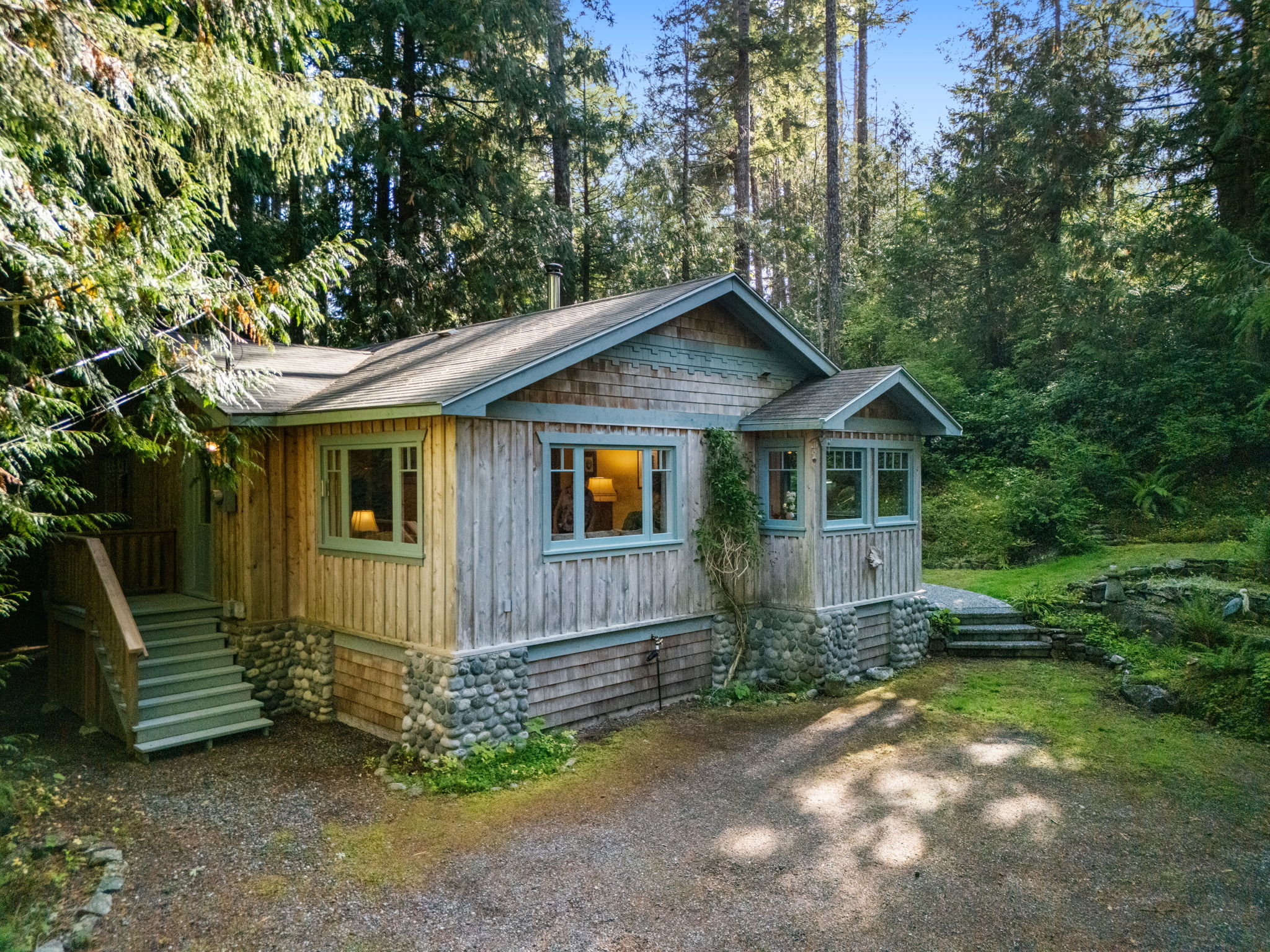 Craftsman-inspired 1955 home, relocated to the property in 1995 onto a new foundation and services