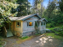 Craftsman-inspired 1955 home, relocated to the property in 1995 onto a new foundation and services