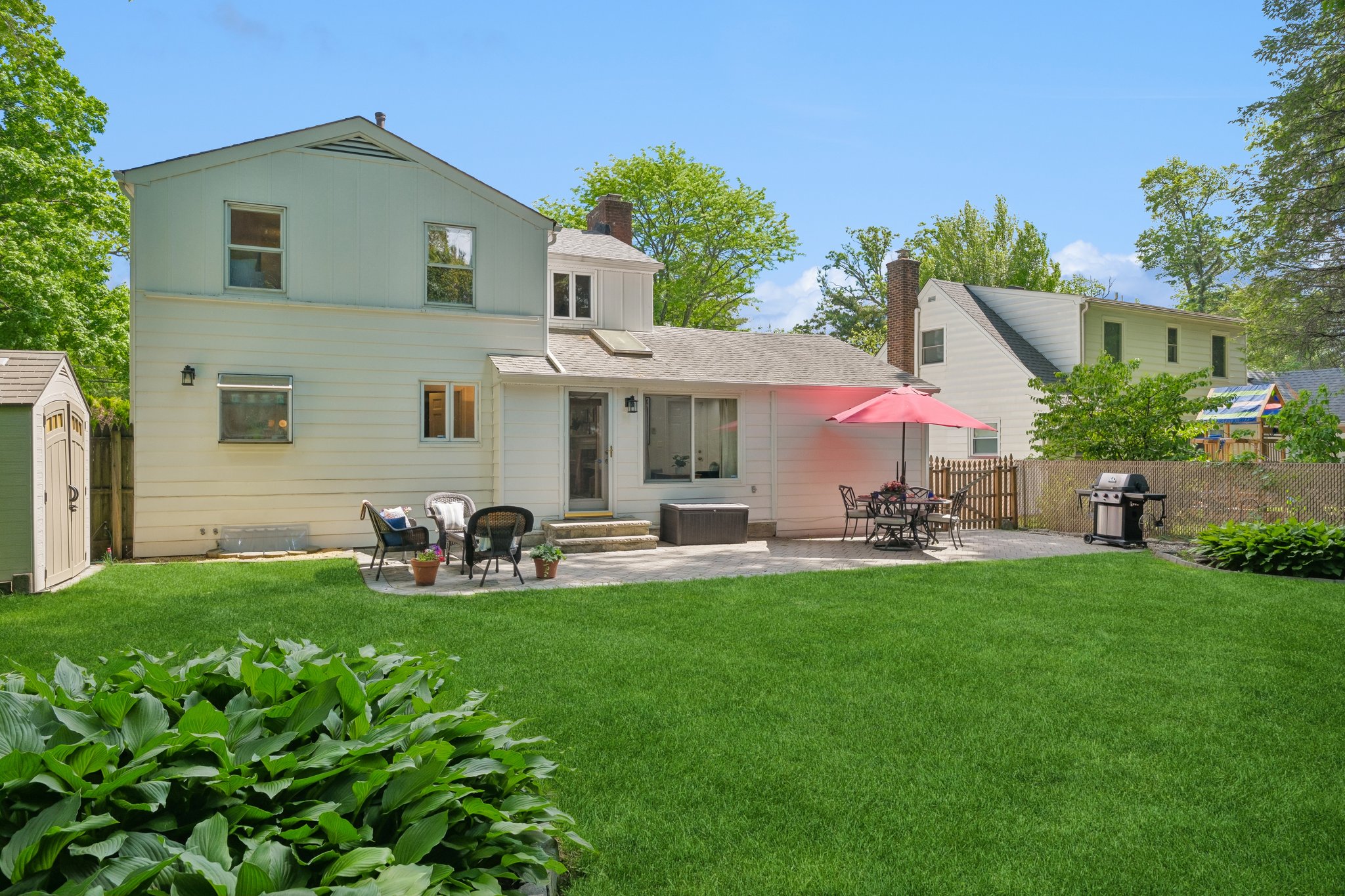 Private backyard. Mature trees. Dinner outside all summer.