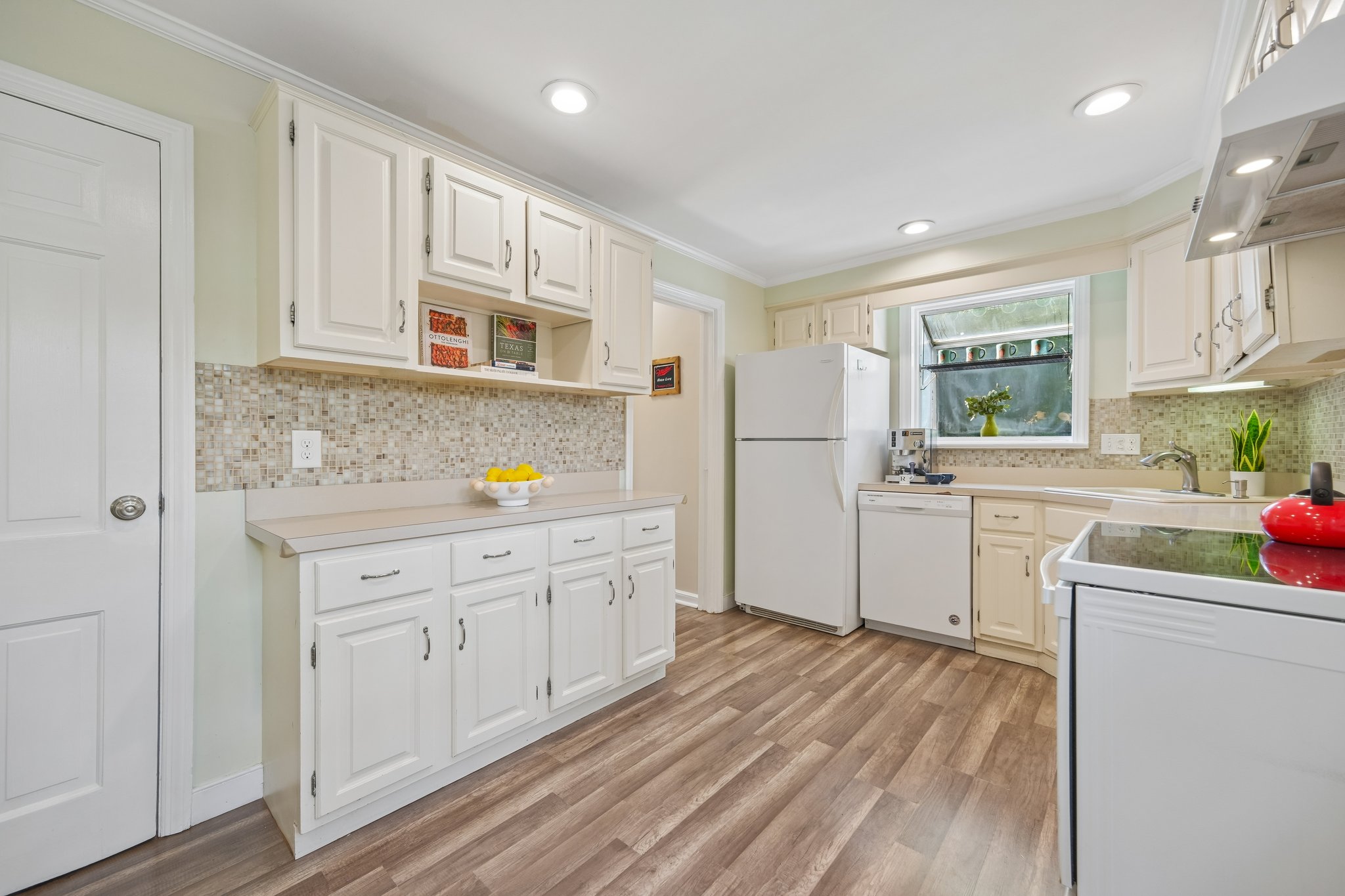 Saturday mornings might start at the nearby Montclair Farmers Market gathering fresh flowers, peaches, warm bread, and whatever looks too good to leave behind - then back home to a kitchen made for easy cooking and lingering conversations.