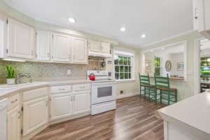 The breakfast bar becomes command central here - morning coffee, homework help, late-night chats, and quick bites before the NYC commute. The kind of kitchen that quietly keeps everyone connected.