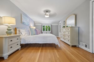 Large enough for a king bed and a quiet sitting moment by the windows, this serene primary bedroom feels tucked away from the world - bright, airy, and beautifully restful from morning to night.