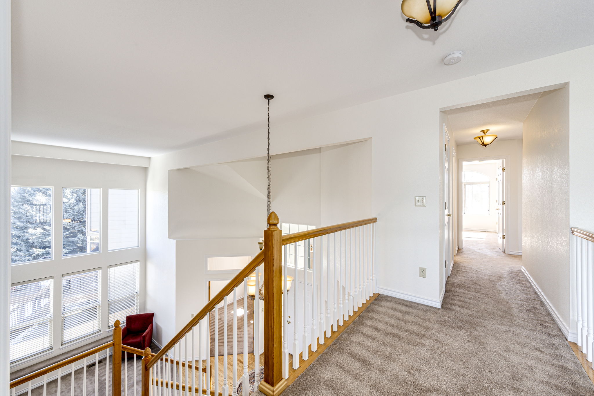 Second floor hallway view leading to the upper 3 bedrooms and full bathroom