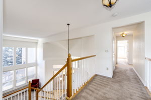Second floor hallway view leading to the upper 3 bedrooms and full bathroom