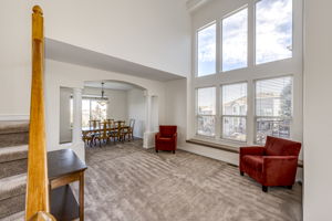 Front door entry view of the Living room area and Dining room. High ceilings and lots of big windows throughout the home!