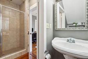 The bath features a walk-in shower and a private water closet.