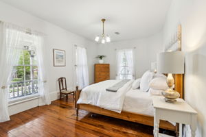 The spacious, light-filled primary suite ...