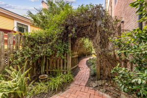 ...and seasonal blooms, such as the fragrant jasmine that covers this trellis.