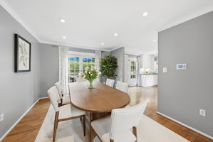 Recessed lighting and sliding door leading to rear deck/yard
