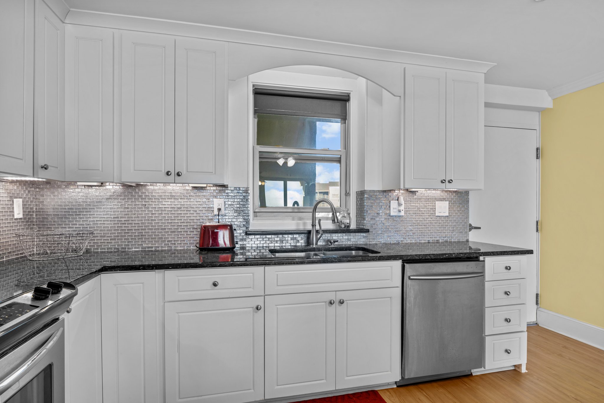 Kitchen w/ Polished Black Granite Counters