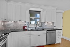 Kitchen w/ Polished Black Granite Counters