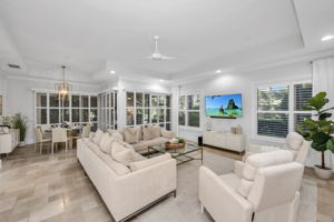 Open concept great room with chiseled-edge marble flooring.