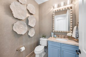 Powder room located near the office.