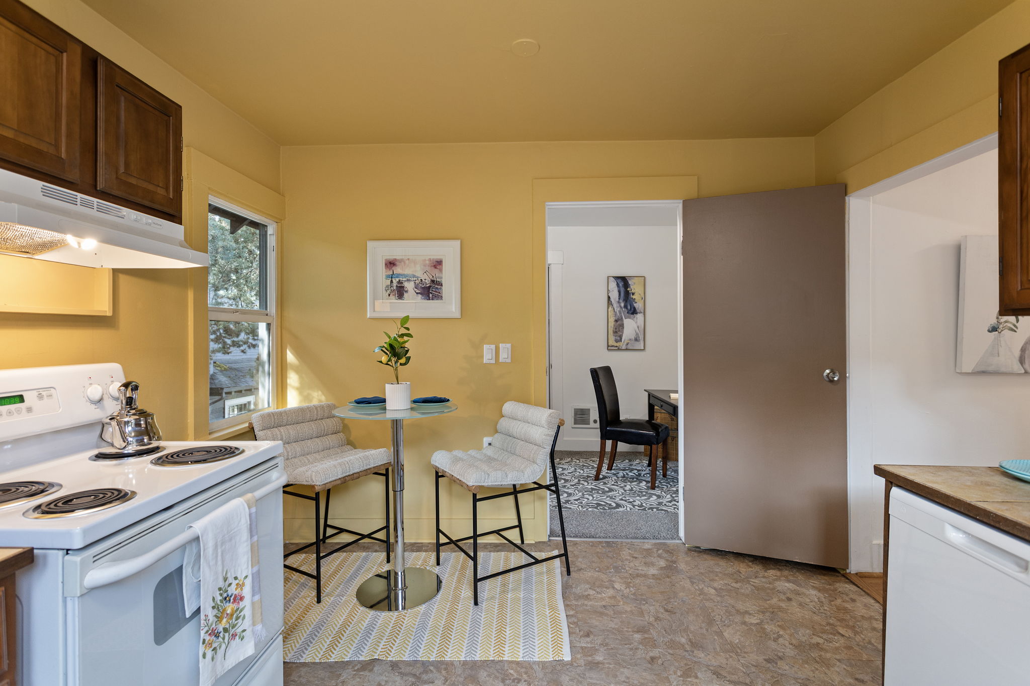 The kitchen’s dining area sits beside a south-facing window.