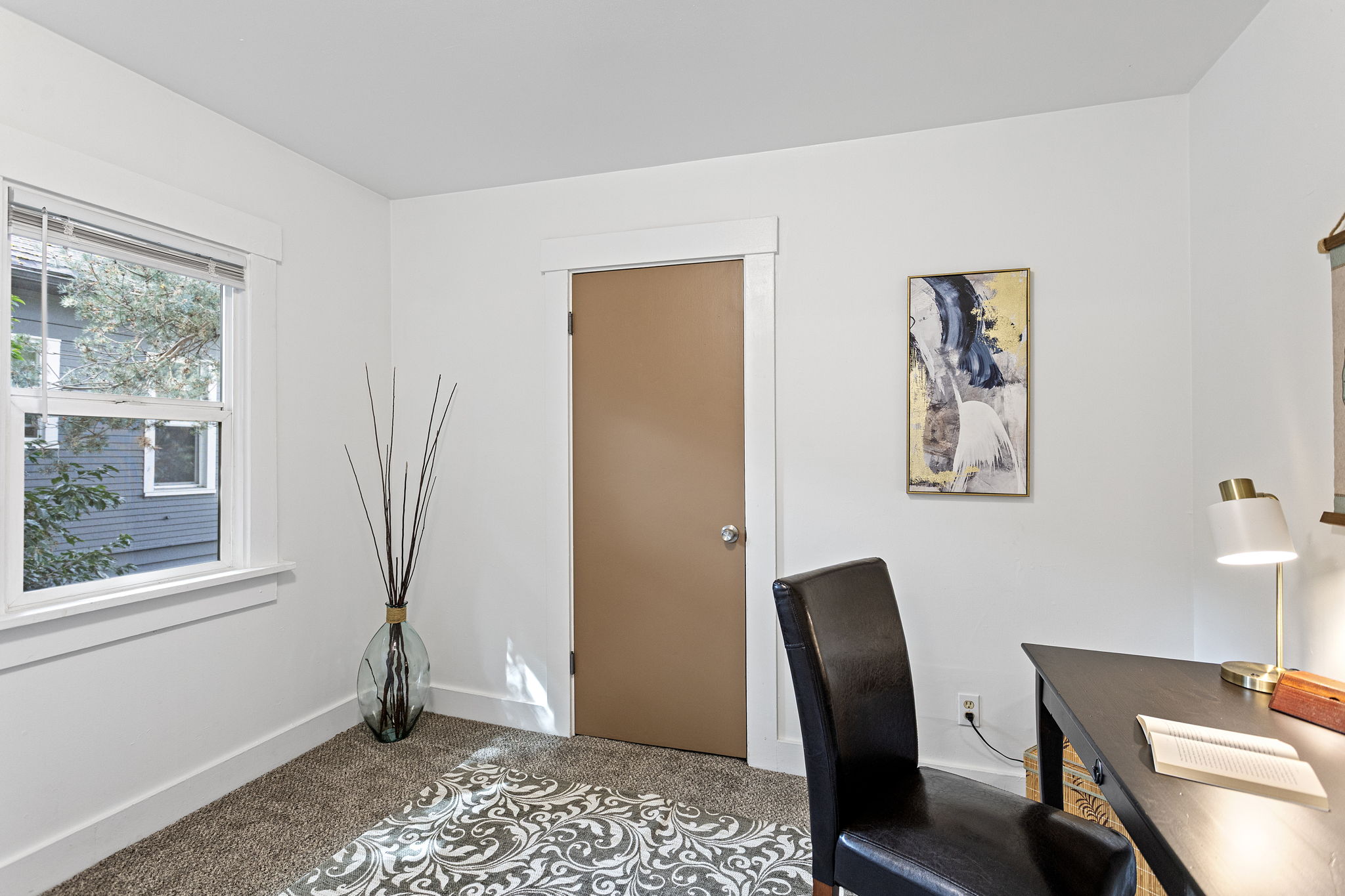 A small bonus room just off the kitchen includes a walk-in closet.