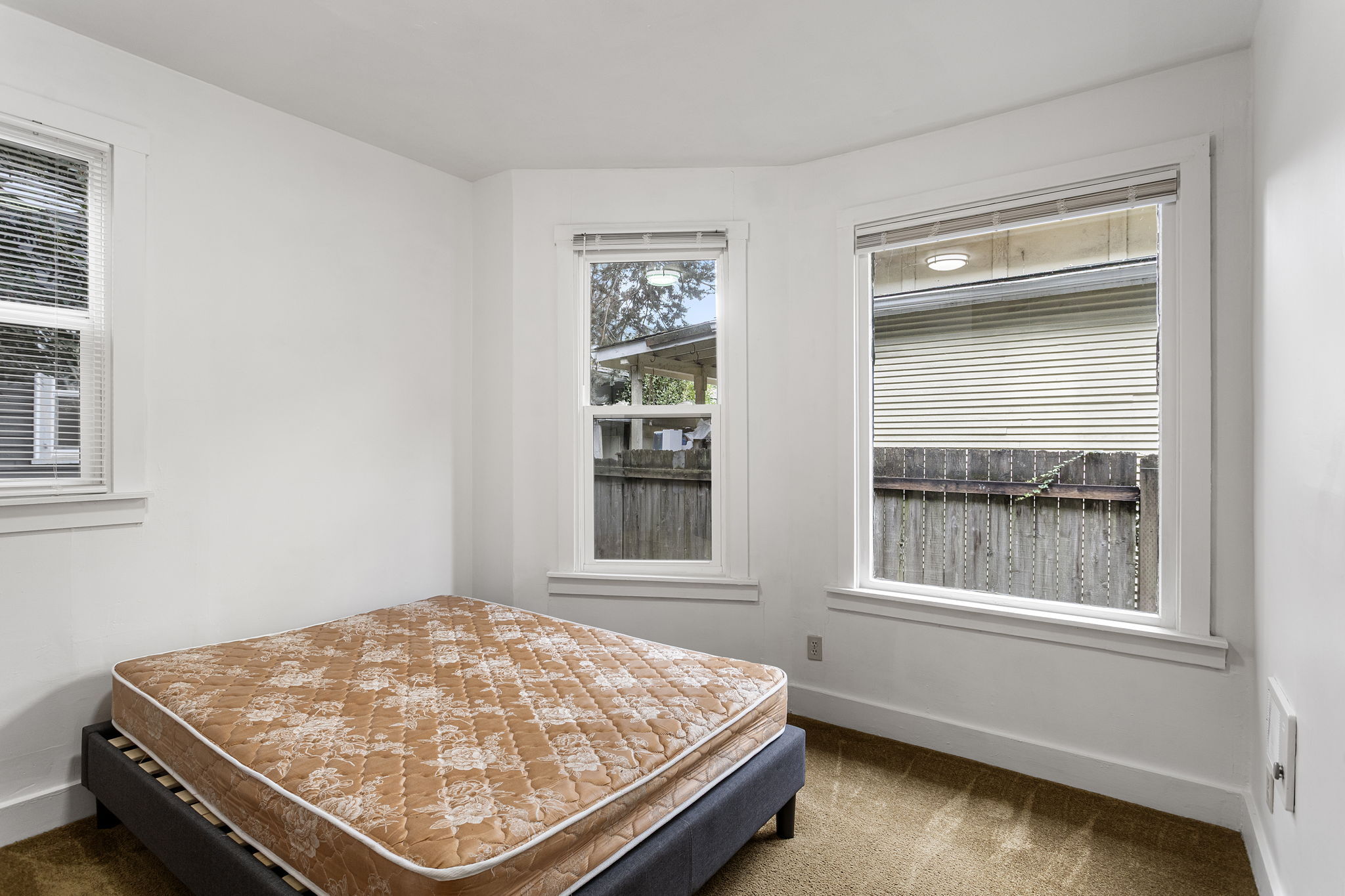 South- and west-facing windows bring light from two directions, with an outlook toward the backyard.