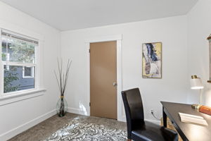 A small bonus room just off the kitchen includes a walk-in closet.