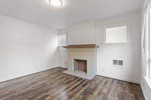 The decorative fireplace surround gives the room a strong period focal point.