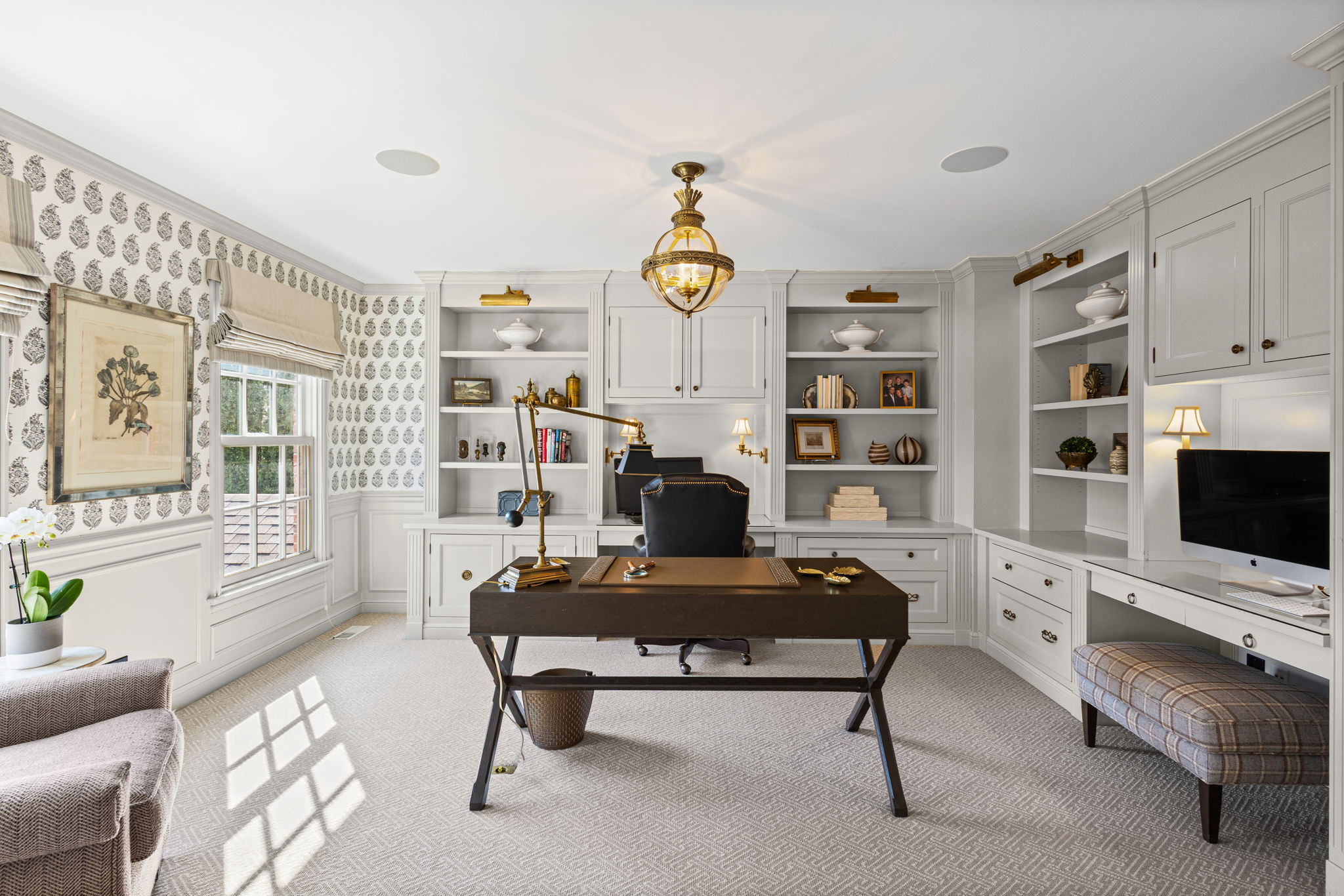 Office with built-in cabinets and shelves