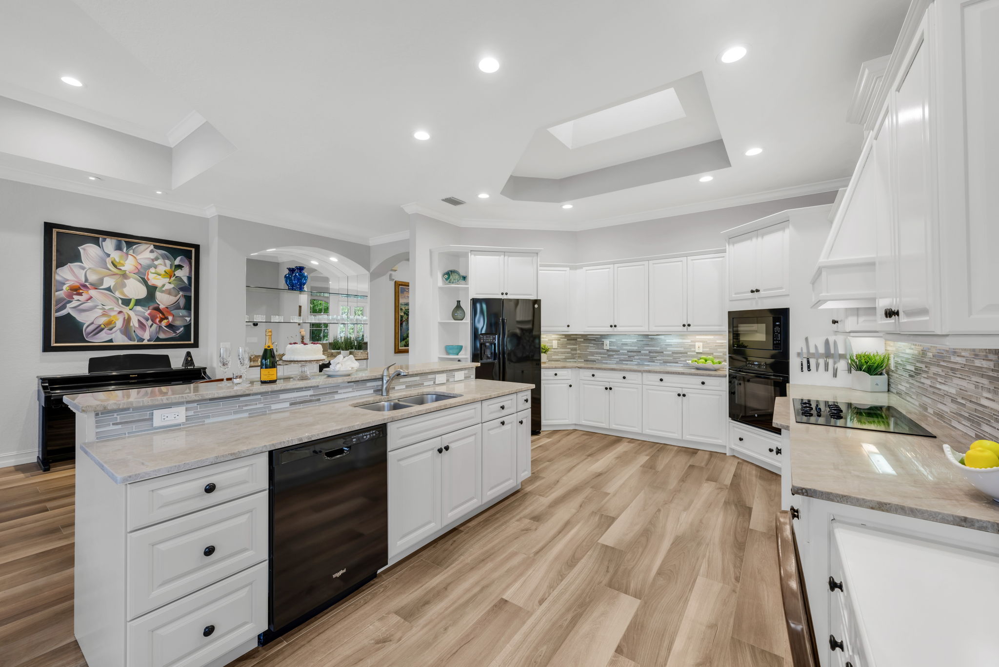 This large, cheery kitchen opens up to the bar and family room, and has amazing views!