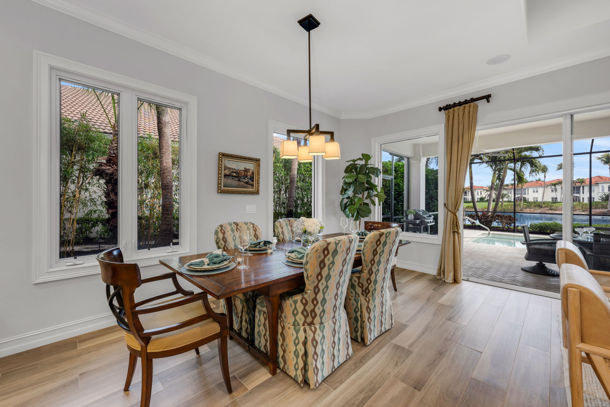 There is a dining room right off of the kitchen, steps away from the lanai.