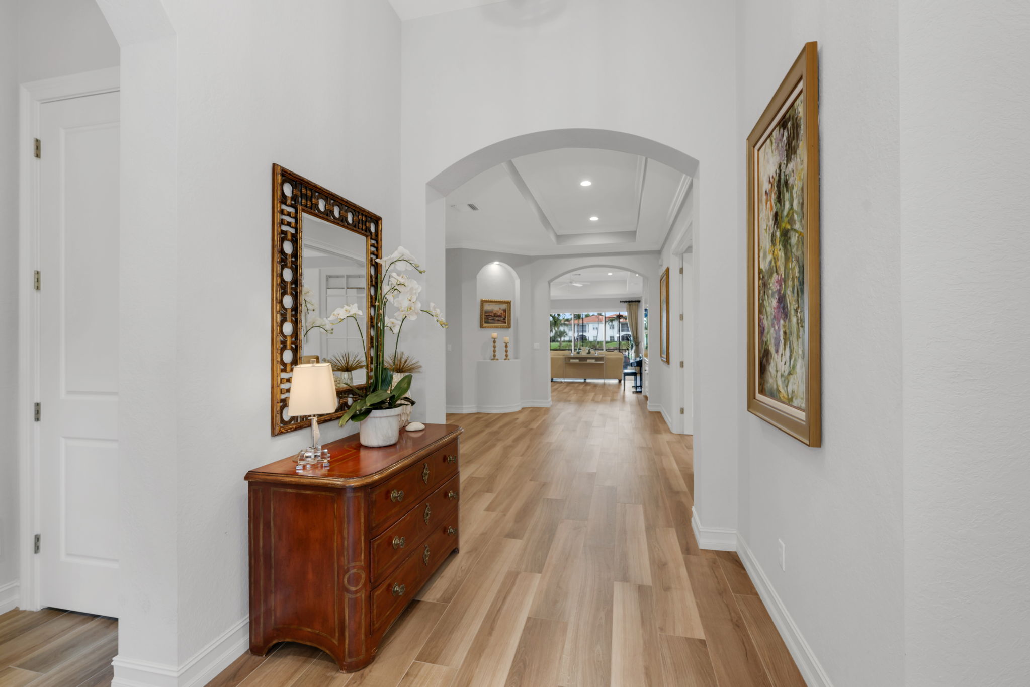 Upon entering this home, there is one guest room to the left, and another to the right, with the primary bedroom on the opposite side of the home.