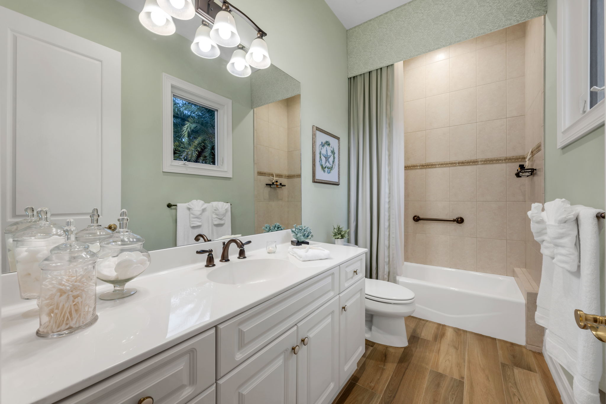 The second guest bathroom includes a shower/tub combination.