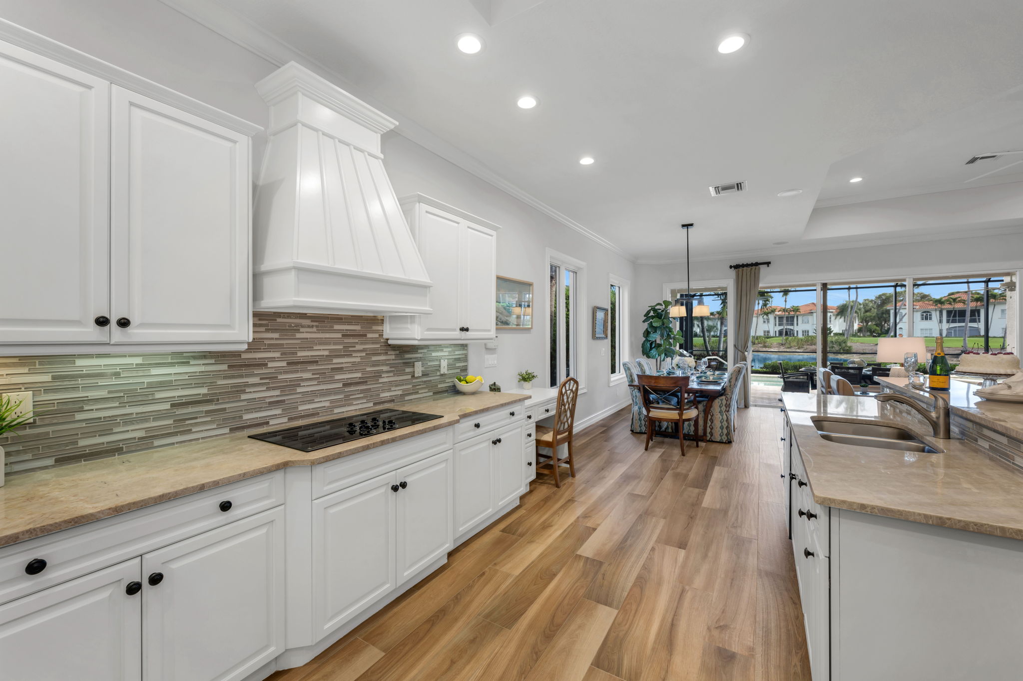 Updated chef's kitchen with granite countertops, induction cooktop, an eat-in island for our casual, Florida lifestyle...