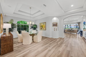 As you walk further into the home, the formal dining room is on your left and across it the spacious den.