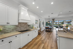 Updated chef's kitchen with granite countertops, induction cooktop, an eat-in island for our casual, Florida lifestyle...