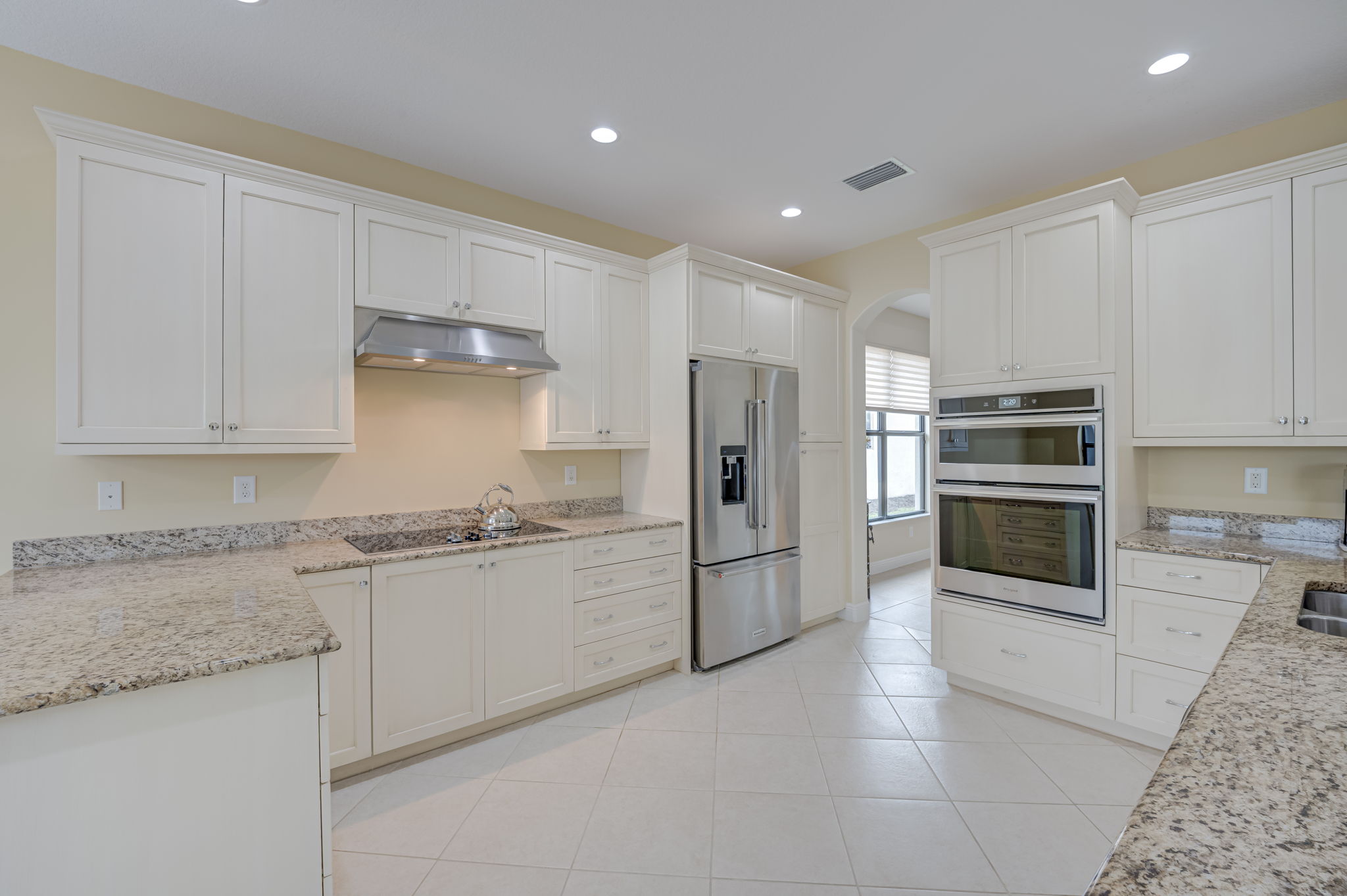Gourmet Kitchen with Abundant Cabinetry & Granite Counters