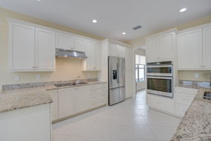 Gourmet Kitchen with Abundant Cabinetry & Granite Counters