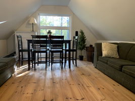 Finished & heated loft space over detached garage. Boasts locally-milled wide-planked pine flooring. The opportunities are endless!