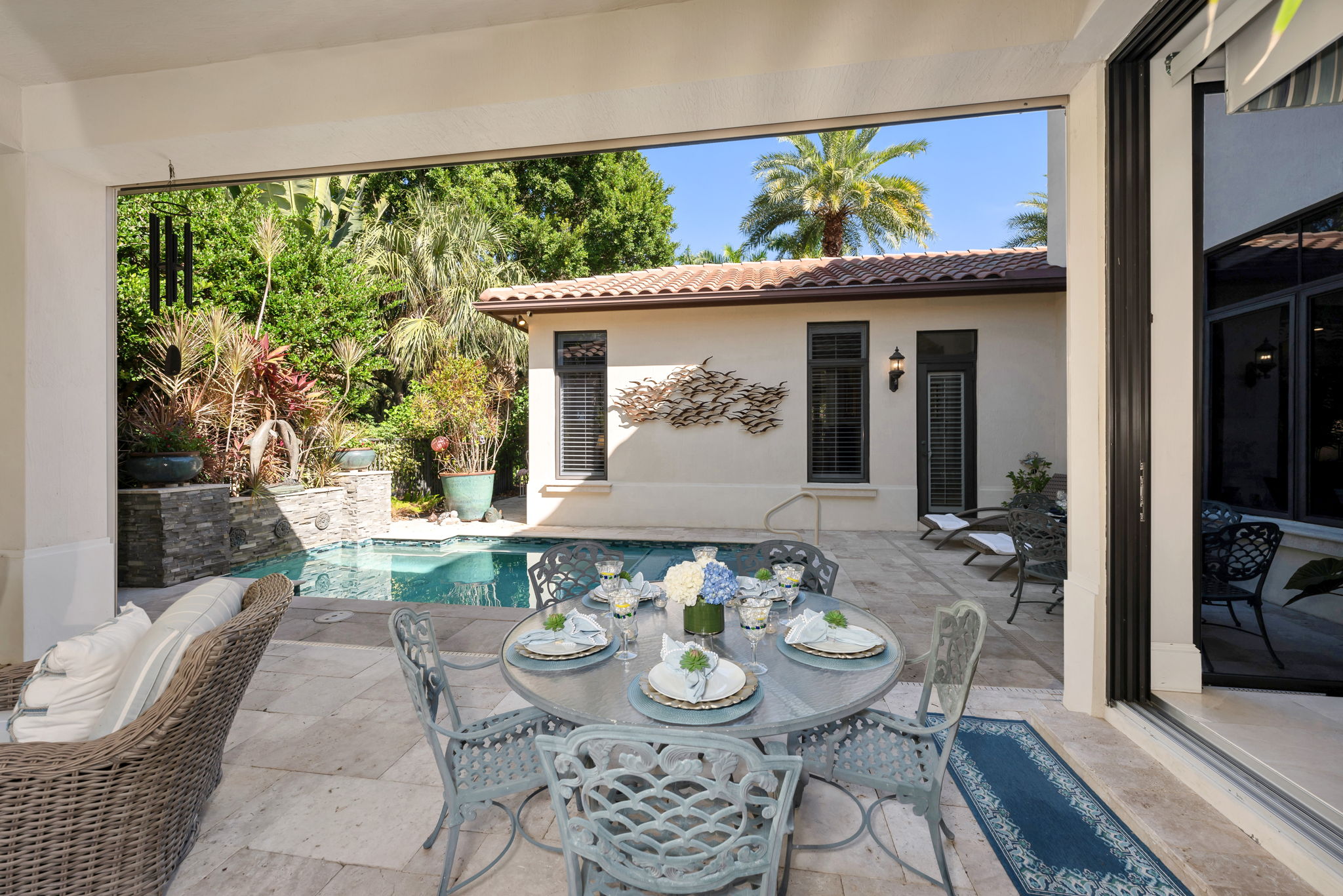 The lanai has automated screens that come down and plenty of space for entertaining.