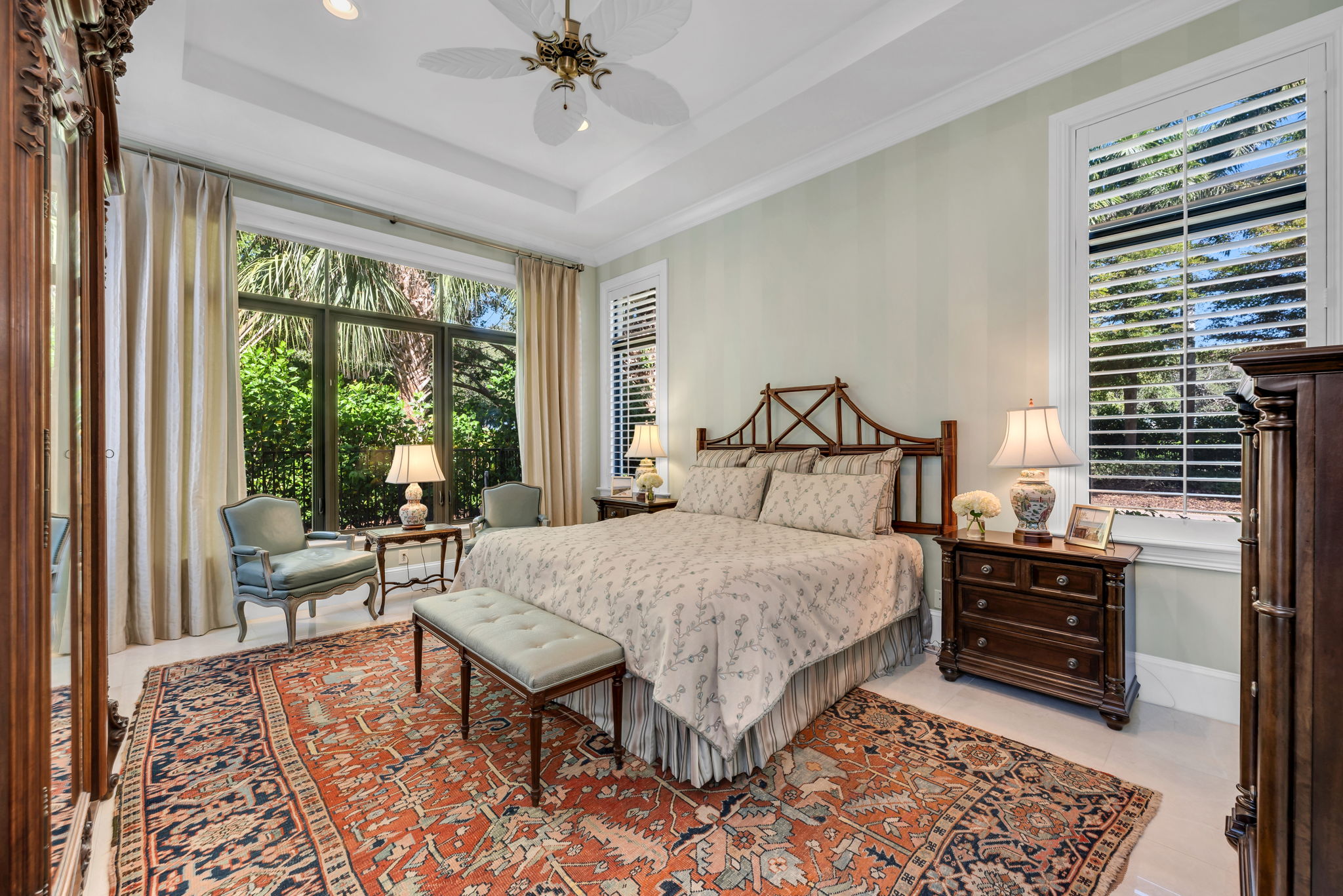 The Primary Suite has marble floors, high ceilings and detailed molding.