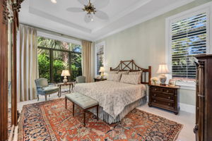 The Primary Suite has marble floors, high ceilings and detailed molding.