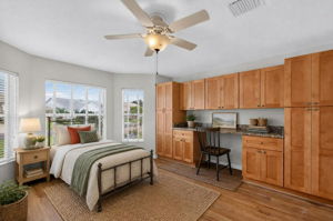 Second Bedroom with Custom Desk and Cabinetry-Virtually Staged